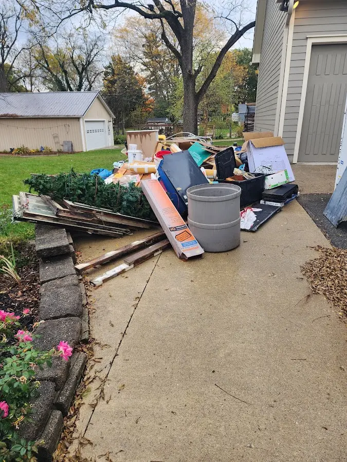 Dumpster being loaded with debris for 10 Yard Dumpster Rental in Ambridge